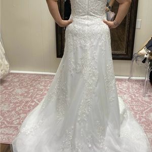 Never worn, Size 16, ivory with sparkles, beaded straps, medium train